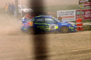 Travis Pastrana / Christian Edstrom Subaru WRX STi at speed on SS1.