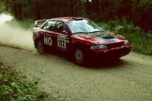 Dennis Martin / Kim DeMotte at speed on SS2 in their Mitsubishi Lancer Evo 4.