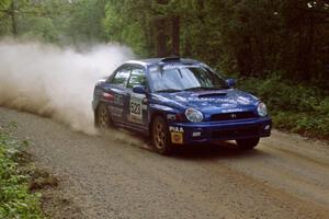 Travis Hanson / Terry Hanson Subaru Impreza WRX at speed on SS2.