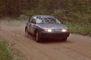 Dan Adamson / Chris Gordon Saturn SL2 at the finish of SS2.