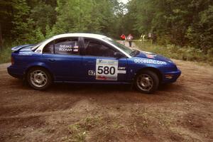 Mike Bodnar / Elaine Sheaks on SS3 at a hairpin in their Saturn SL2.