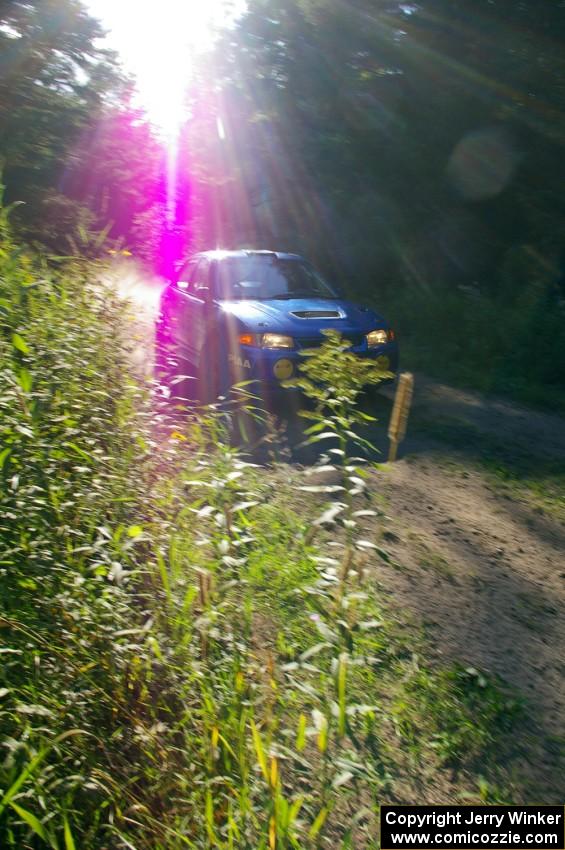 Dmitri Kishkarev / Hugh Hutchinson Mitsubishi Lancer Evo 4 on the practice stage.