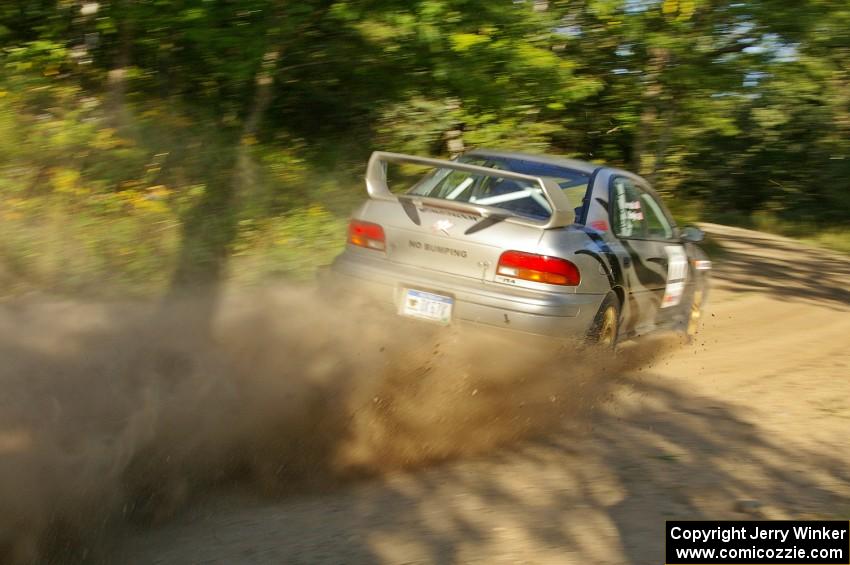 Jeff Moyle / Michael Yarroch Subaru Impreza blasts out of a right-hander on the practice stage.