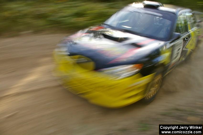 The Andy Pinker / Robbie Durant Subaru WRX STi takes a fast left-hander perfectly on the practice stage.