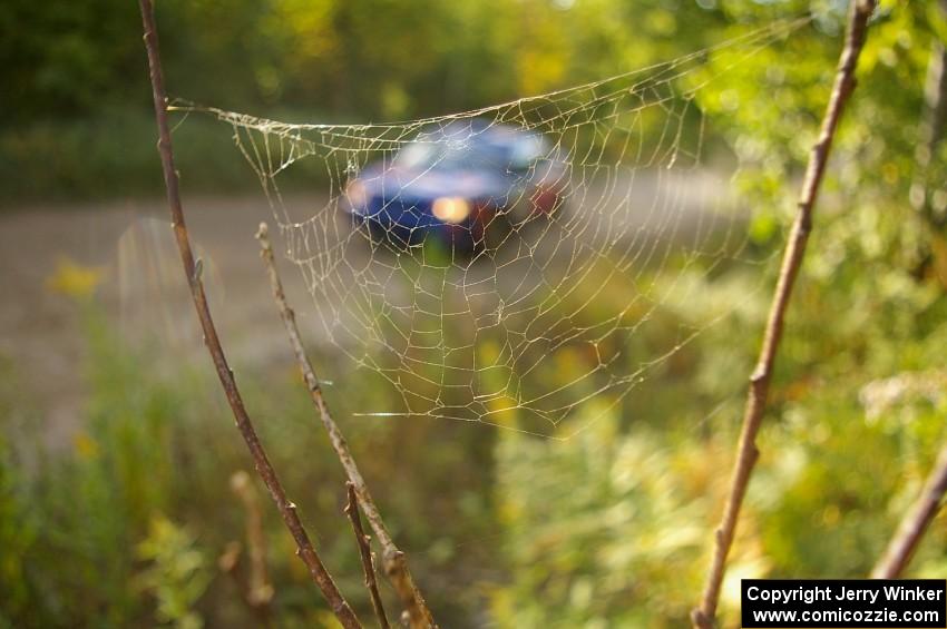 Tim Penasack / Scott Putnam are captured in a web while on the practice stage in their Subaru WRX.