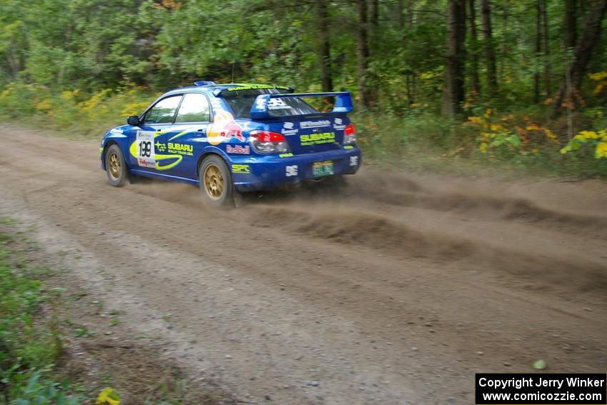 The Travis Pastrana / Christian Edstrom Subaru WRX STi hits the gas coming out of a 90-left on the practice stage.