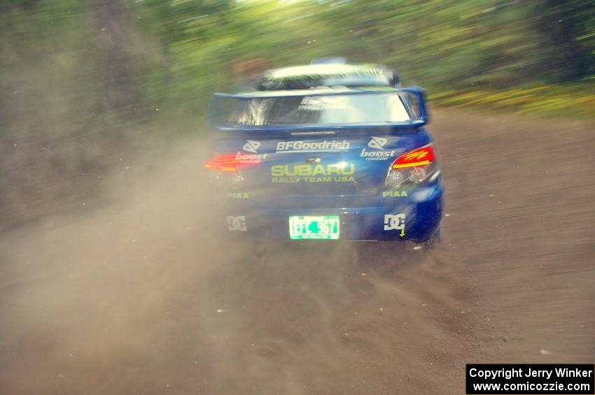 Travis Pastrana / Christian Edstrom Subaru WRX STi blasts gravel while taking a hard left-hander on the practice stage.