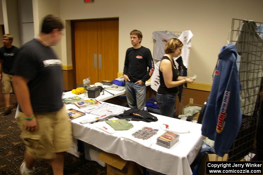 Emily Burton-Weinman sells Rally-America related articles with her boyfriend at registration.