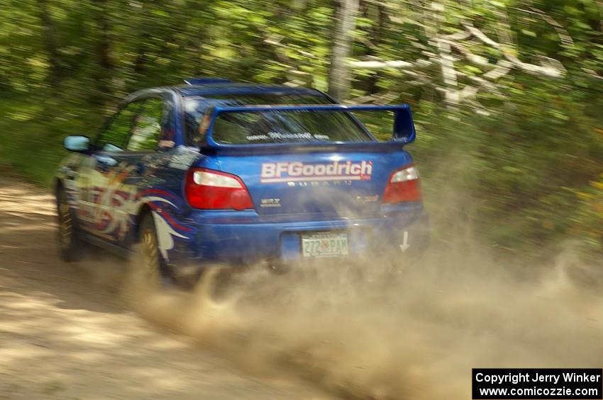 Kenny Bartram / Dennis Hotson Subaru WRX STi rockets down a straight near the flying finish of the press stage.