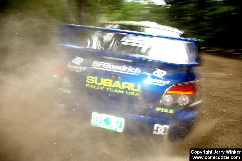 The Travis Pastrana / Christian Edstrom Subaru WRX STi sprays gravel on the press stage.