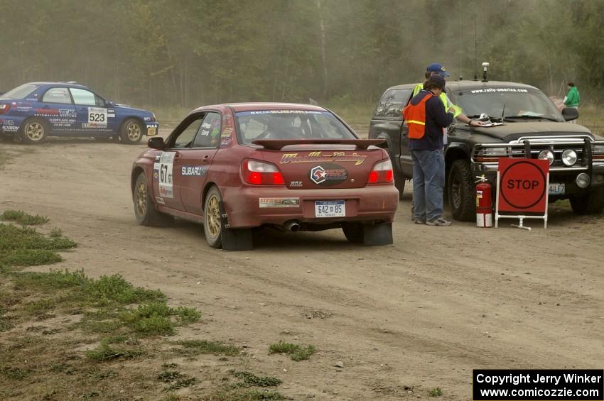 Bryan Pepp / Jerry Stang Subaru WRX checks into the finish control of SS1.