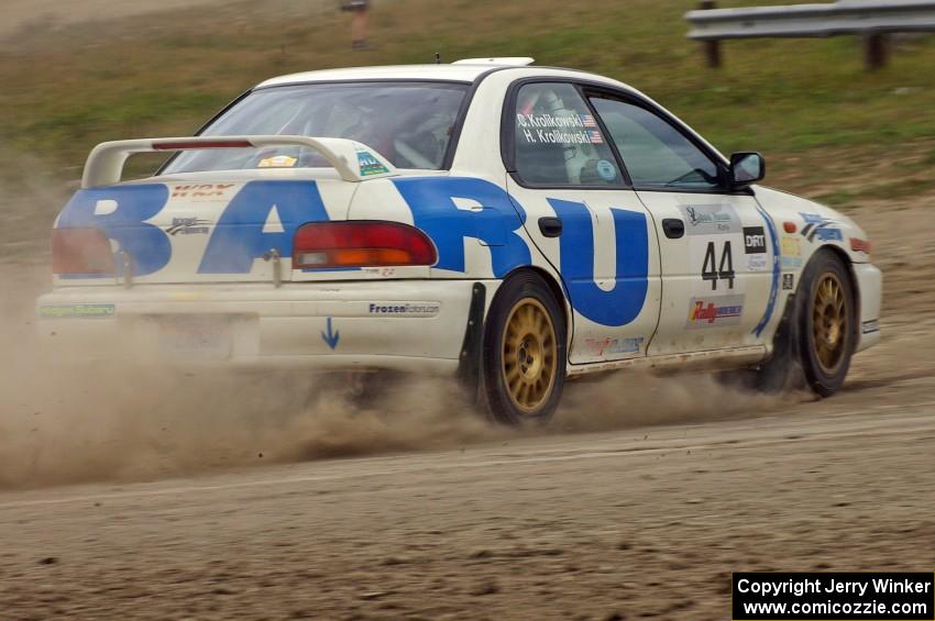 Henry Krolikowski / Cindy Krolikowski Subaru Impreza at a 90-left on SS1.