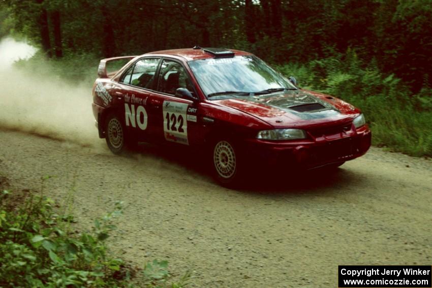 Dennis Martin / Kim DeMotte at speed on SS2 in their Mitsubishi Lancer Evo 4.