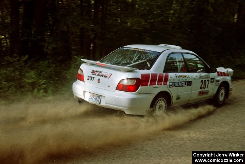 Dave Hintz / John Dillon Subaru WRX at speed on a fast left-hander on SS2.