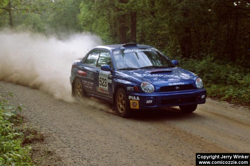 Travis Hanson / Terry Hanson Subaru Impreza WRX at speed on SS2.