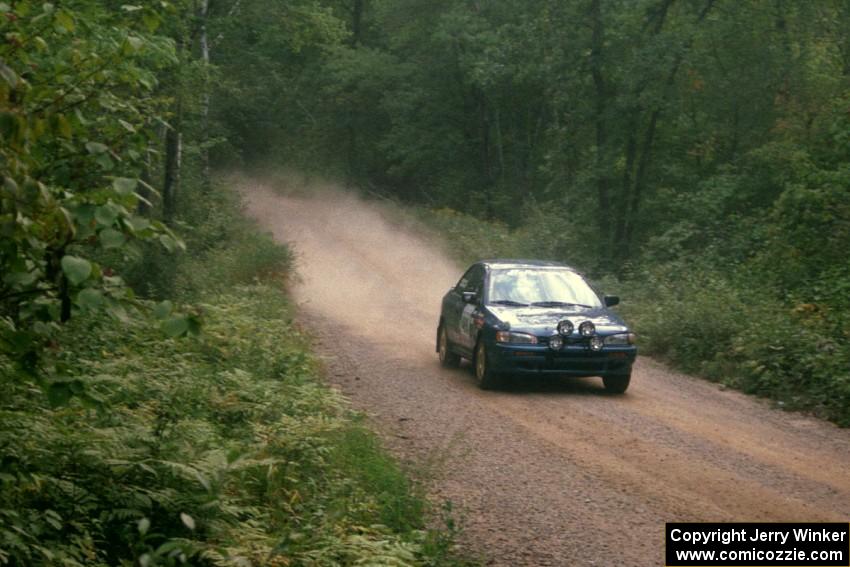 Martin Mennig / Ryan Schnell Subaru Impreza at speed on SS2.