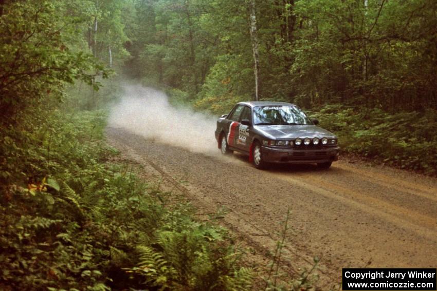Evan Cline / Tracy Manspeaker in their Mitsubishi Galant GSX on SS2.