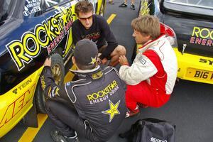 Tanner Foust (back to the camera), Andy Pinker, and Stephan Verdier talk strategy prior to day two of the rally (1).