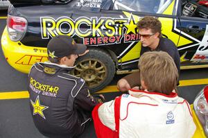Tanner Foust (back to the camera), Andy Pinker, and Stephan Verdier talk strategy prior to day two of the rally (2).