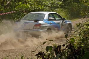 Piotr Wiktorczyk / Martin Brady rocket away from the spectator point on SS9 in their Subaru WRX.