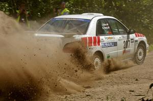 Dave Hintz / John Dillon Subaru WRX sling gravel at the exit of a corner on SS9.