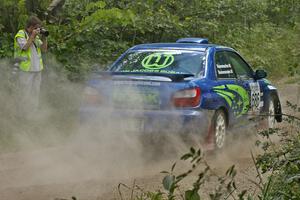 Pete Kuncis snaps a shot of the Heath Nunnemacher / Heidi Nunnemacher Subaru WRX as they exit out of a 90-left on SS9.