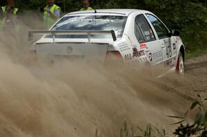 The Lars Wolfe / Jeff Secor VW Jetta Turbo slings gravel at spectators on SS9.