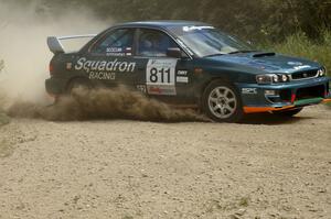 Jaroslaw Sozanski / Ben Slocum Subaru Impreza slings gravel at the SS9 spectator point (1).