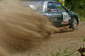 Jaroslaw Sozanski / Ben Slocum Subaru Impreza slings gravel at the SS9 spectator point (2).