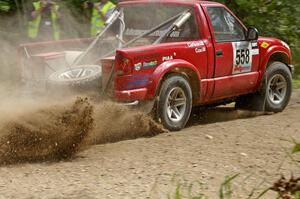 Jim Cox / Brent Carlson Chevy S-10 slings gravel at a 90-left on SS9.