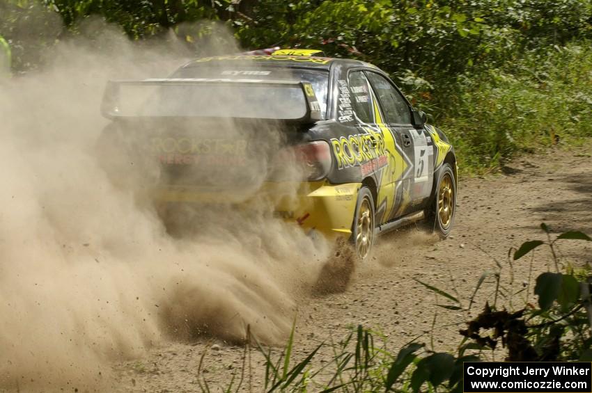 Andy Pinker / Robbie Durant Subaru WRX STi powers out of corner on SS9.