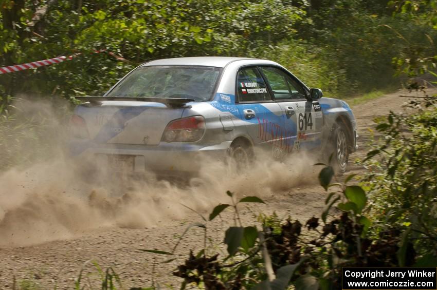 Piotr Wiktorczyk / Martin Brady rocket away from the spectator point on SS9 in their Subaru WRX.