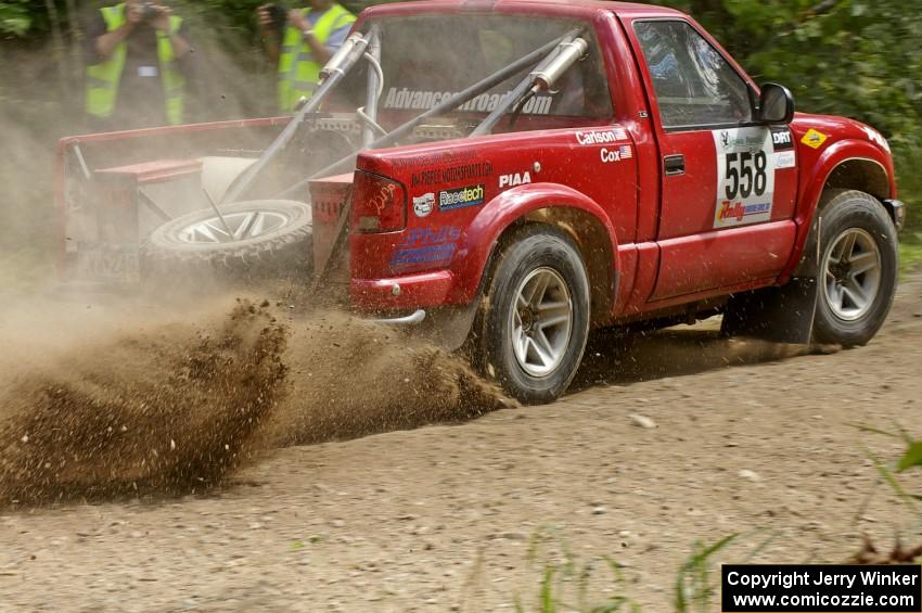Jim Cox / Brent Carlson Chevy S-10 slings gravel at a 90-left on SS9.