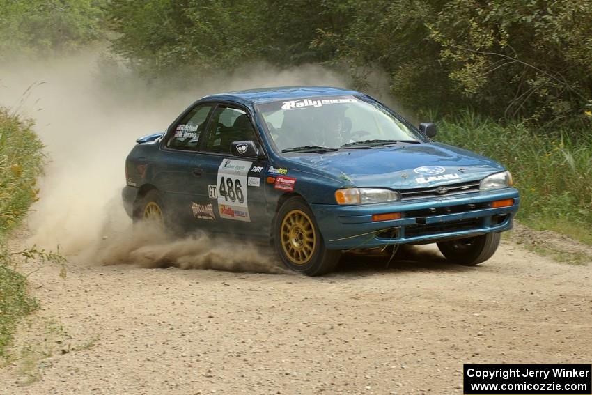 Martin Mennig / Ryan Schnell Subaru Impreza at the SS9 spectator point (1).