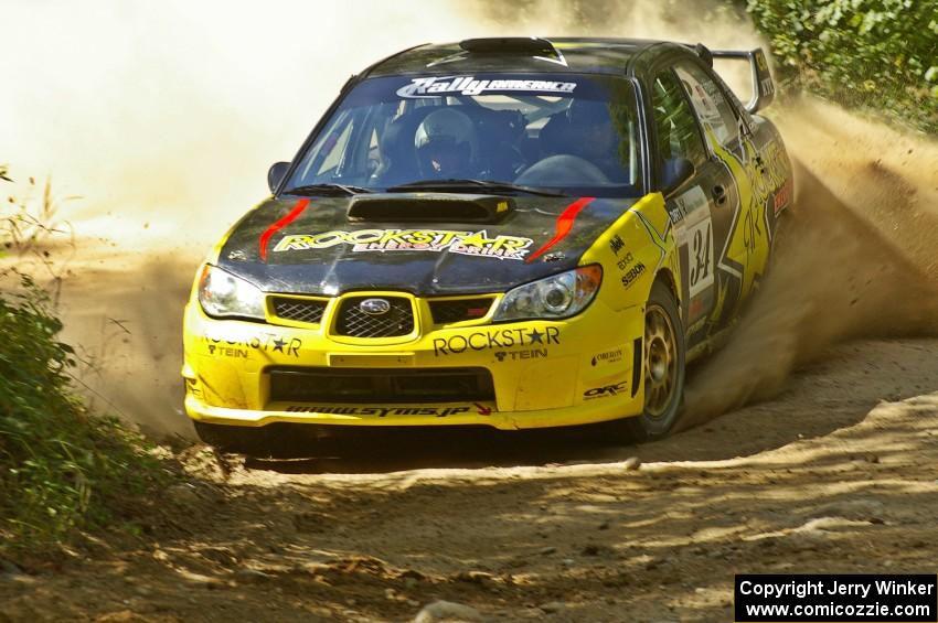 Tanner Foust / Chrissie Beavis Subaru WRX STi at the 90-right after the double-jump on SS12.