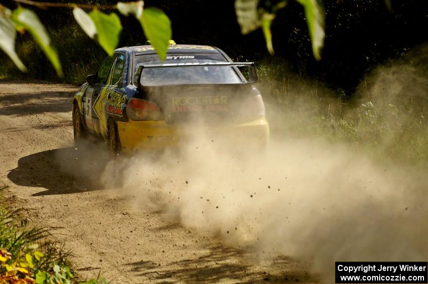 Andy Pinker / Robbie Durant Subaru WRX STi powers down a long straight on SS12.