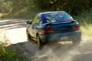 Martin Mennig / Ryan Schnell Subaru Impreza rockets down the 3/4 mile straight on SS12 before the spectator area.