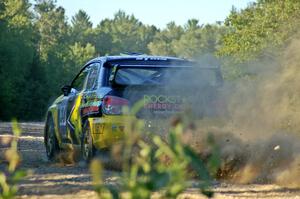 Tanner Foust / Chrissie Beavis Subaru WRX STi blasts onto the county road at the spectator point on SS13.