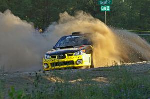 Andy Pinker / Robbie Durant Subaru WRX STi throws a wave of gravel over the car at the SS13 spectator point.