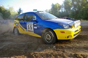 Kyle Sarasin / Mikael Johansson blast onto the county road on SS13 in their Ford Focus SVT.
