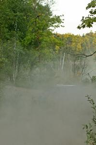 Tanner Foust / Chrissie Beavis Subaru WRX STi leave a trail of dust behind them as they rocket downhill on SS15.