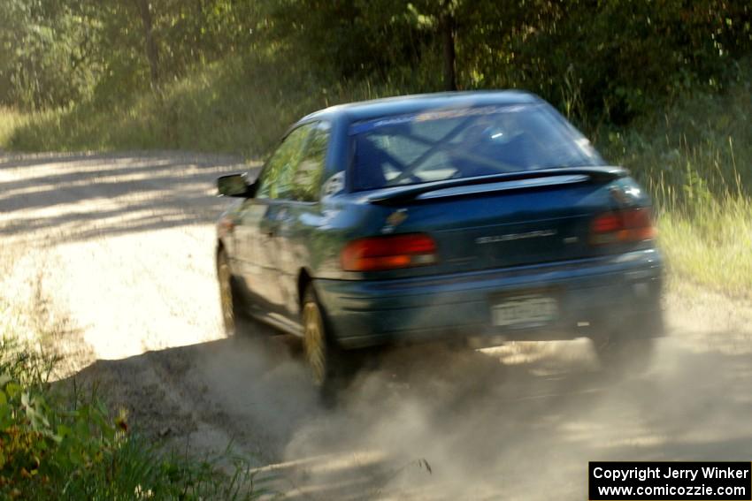 Martin Mennig / Ryan Schnell Subaru Impreza rockets down the 3/4 mile straight on SS12 before the spectator area.