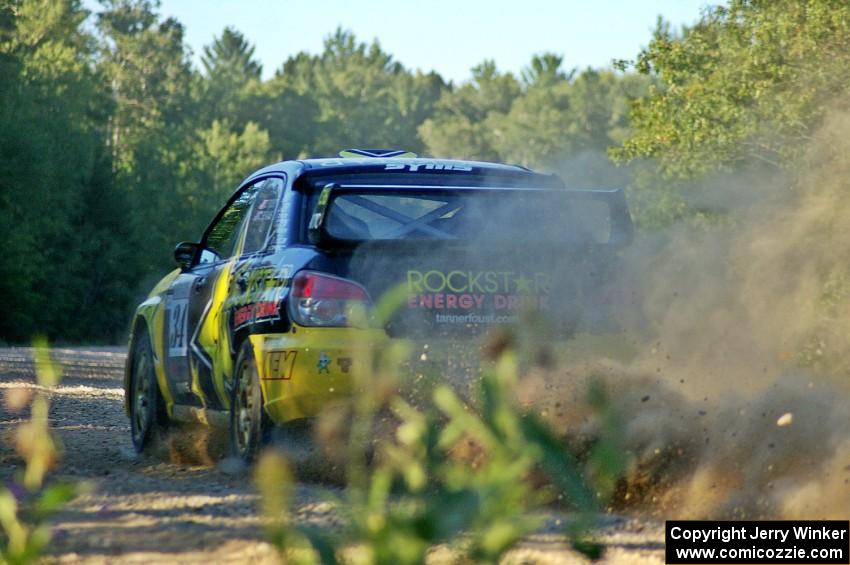 Tanner Foust / Chrissie Beavis Subaru WRX STi blasts onto the county road at the spectator point on SS13.