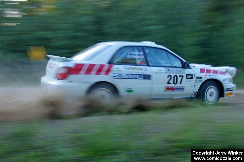 Dave Hintz / John Dillon Subaru WRX prepares to go back into the woods from the county road at the spectator point on SS13.