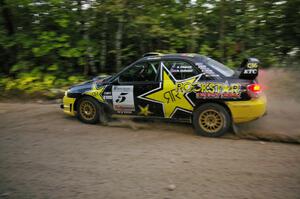 Andy Pinker / Robbie Durant lost alot of time on SS15 changing a tire on their Subaru WRX STi.
