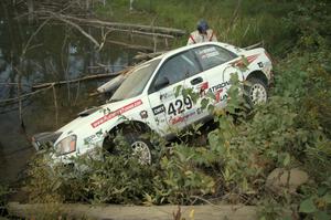 Stephan Verdier / Scott Crouch put their Subaru WRX off the road and onto a rockpile on SS15 ending their day.