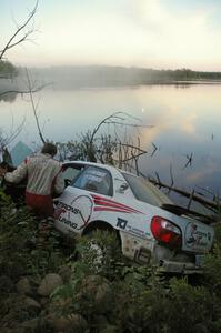 Stephan Verdier / Scott Crouch put their Subaru WRX off the road and onto a rockpile near the shore of McKenzie Lake on SS15.