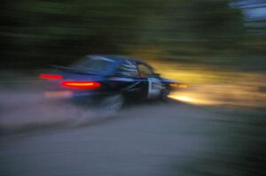 Don Kennedy / Matt Kennedy Subaru Impreza at speed on SS15 just after sundown.