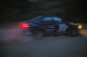 Travis Hanson / Terry Hanson Subaru Impreza WRX at speed on SS15 after sundown.