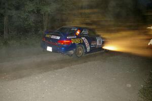 Kazimierz Pudelek / Mariusz Malik Subaru Impreza crawls through the dust on SS15.